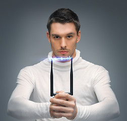 Image showing futuristic man with stun gun