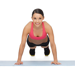 Image showing beautiful sporty woman doing exercise