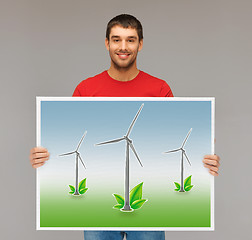 Image showing man with picture of wind turbines