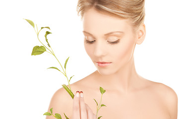 Image showing woman with green sprout