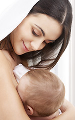 Image showing happy mother with baby at home
