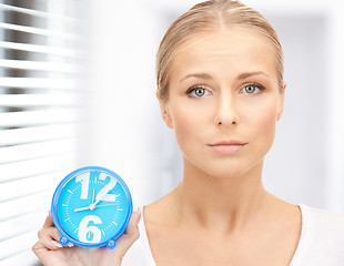 Image showing woman holding alarm clock