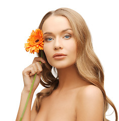 Image showing lovely woman with gerbera flower