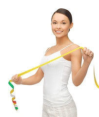 Image showing sporty woman with measuring tape