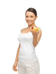 Image showing healthy woman holding bowl with fruit salad