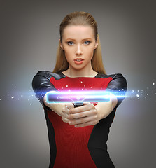 Image showing futuristic woman with gadget