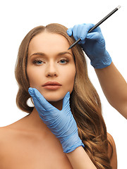 Image showing woman face and beautician hands