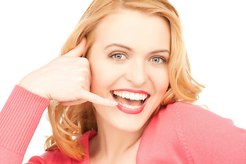 Image showing woman making a call me gesture