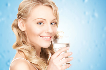 Image showing woman hands holding glass of water