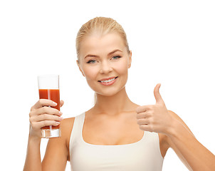 Image showing woman holding glass of tomato juice