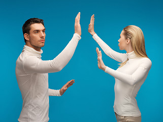 Image showing man and woman working with something imaginary