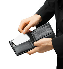 Image showing man in suit holding credit card