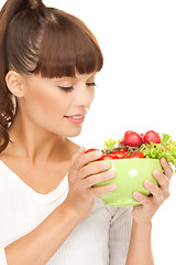 Image showing woman in the kitchen with tomatoes