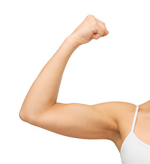 Image showing sporty woman flexing her biceps