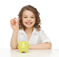 Image showing girl with piggy bank