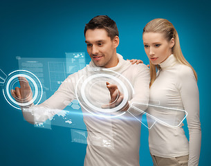 Image showing man and woman working with virtual screens