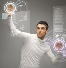 Image showing man working with virtual screens