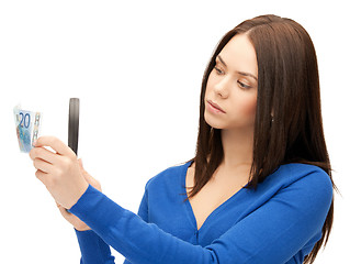 Image showing woman with magnifying glass and euro cash money