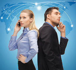 Image showing man and woman with cell phones