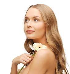 Image showing lovely woman with gerbera flower