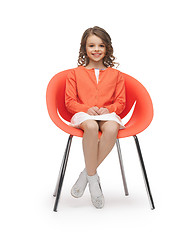 Image showing pre-teen girl in casual clothes sitting on chair