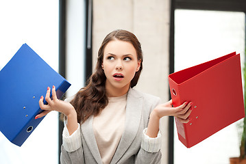 Image showing unsure thinking or wondering woman with folder