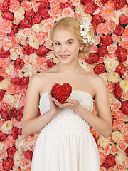 Image showing woman with heart and background full of roses