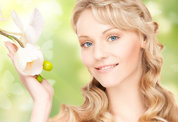 Image showing beautiful woman with orchid flower and butterflies