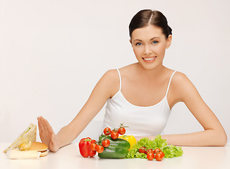 Image showing woman with hamburger and vegetables