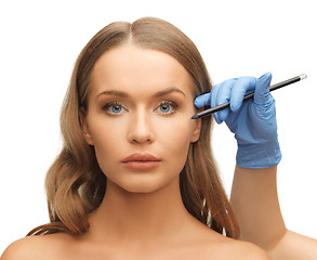 Image showing woman face and beautician hands