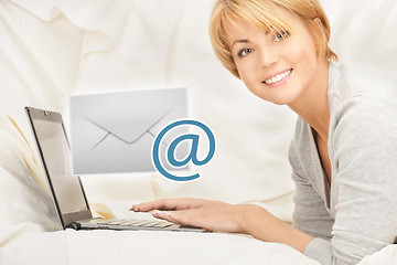 Image showing woman with laptop computer sending e-mail