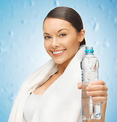 Image showing woman with towel and bottle of water