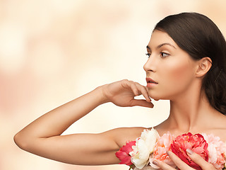 Image showing relaxed woman with flowers