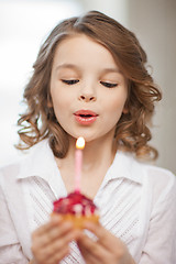 Image showing girl with cupcake
