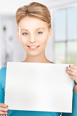 Image showing happy smiling woman with blank paper