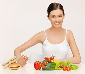 Image showing woman with hamburger and vegetables