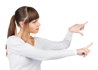 Image showing woman working with something imaginary