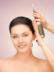 Image showing beautiful woman with comb