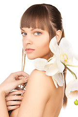 Image showing lovely woman with orchid flower