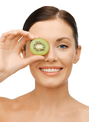 Image showing woman with kiwi slice