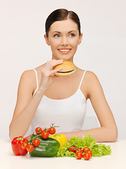 Image showing woman with hamburger and vegetables