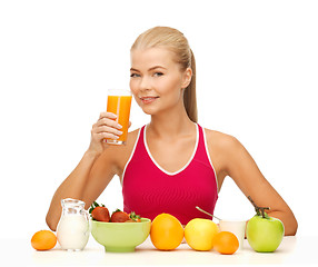 Image showing young woman eating healthy breakfast