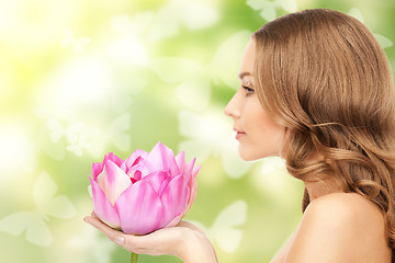 Image showing beautiful woman with lotus flower and butterflies