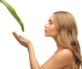 Image showing woman with green leaf