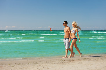 Image showing couple walking on the beach