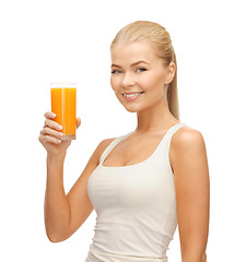 Image showing woman holding glass of orange juice