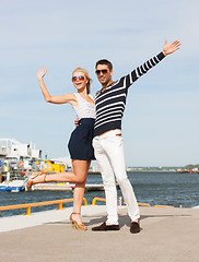 Image showing Couple standing and waving in port