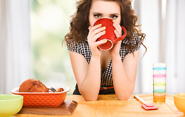 Image showing young attractive woman in the kitchen