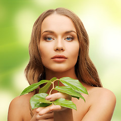 Image showing woman with green leaf