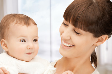 Image showing happy mother with adorable baby